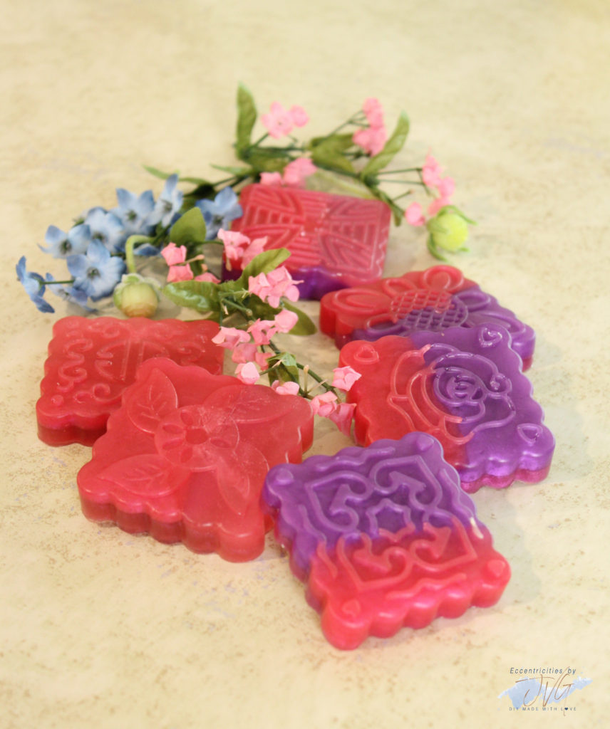 Floral handmade hand soap final products in purple and pink full view